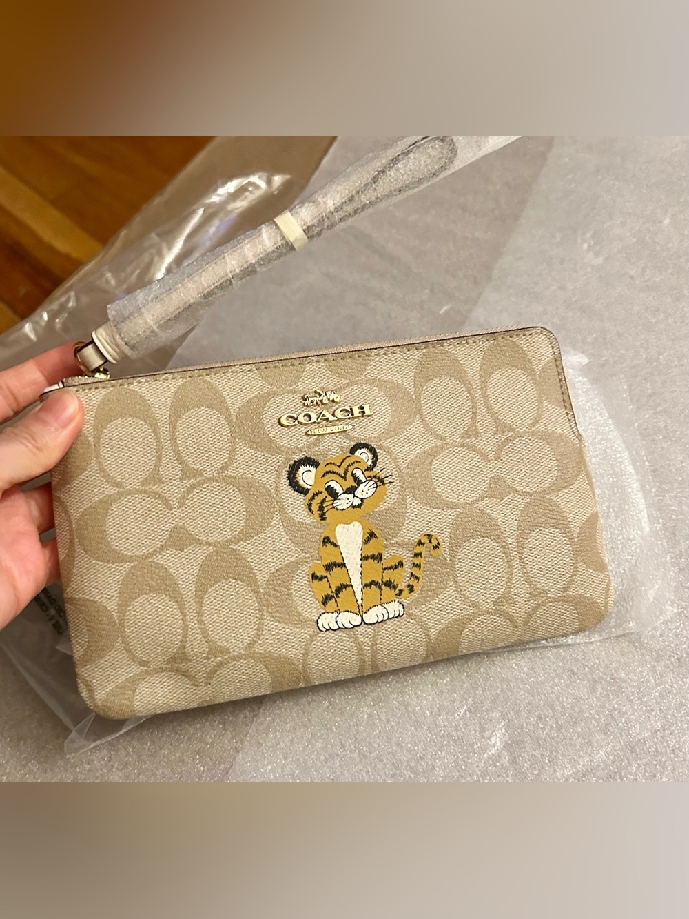 Coach Large Corner Zip Wristlet In Signature Canvas With Tiger